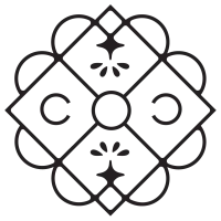 A circular, ornate geometric pattern with a central circle, diamond shapes, and floral accents forming a symmetric, decorative motif.